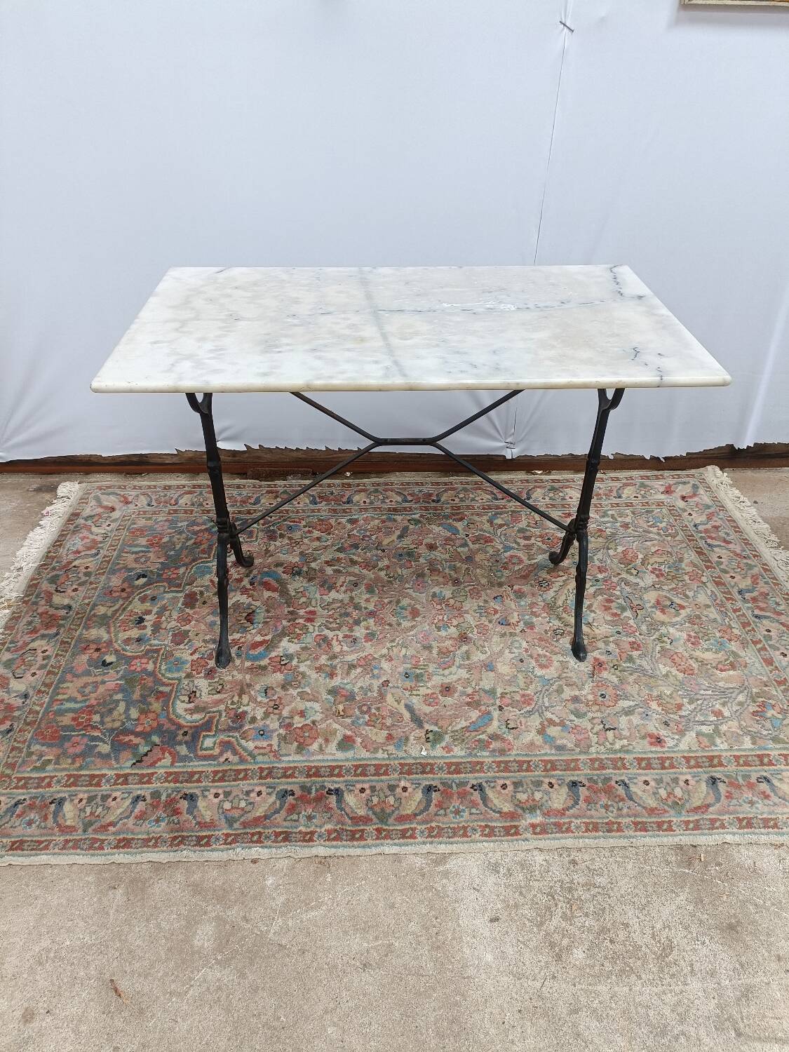 Bistro table with cast iron legs and marble top