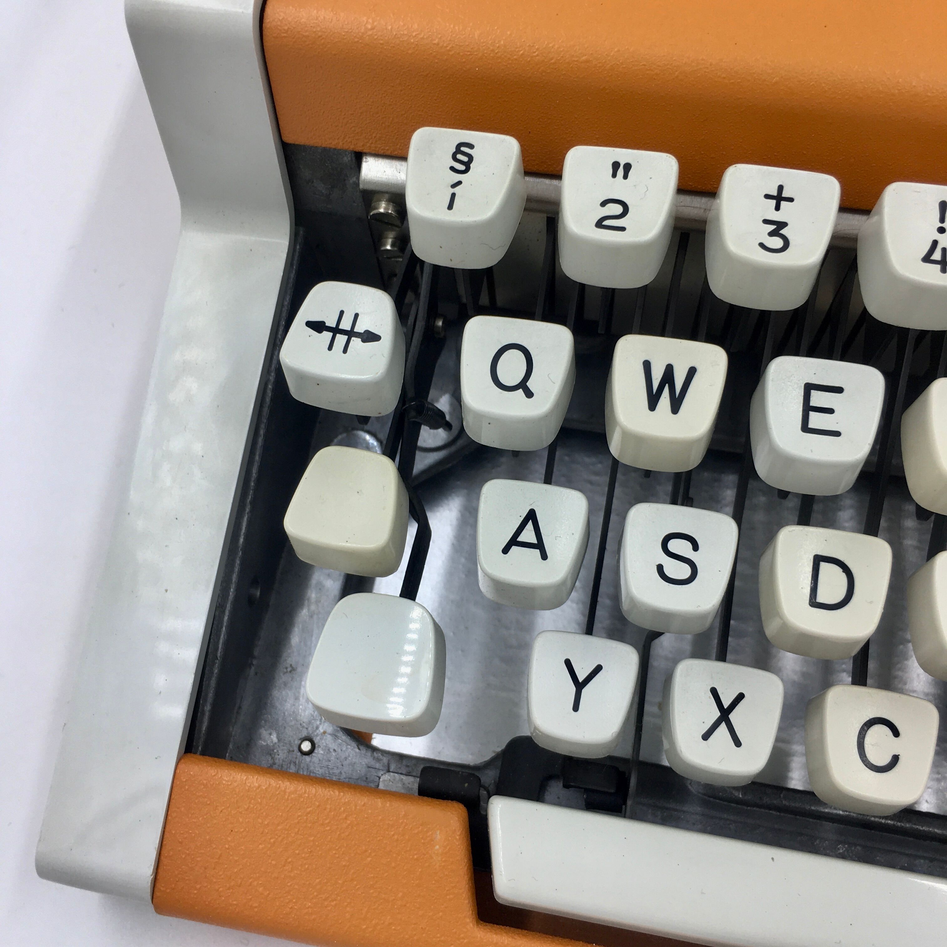 WE typewriter orange