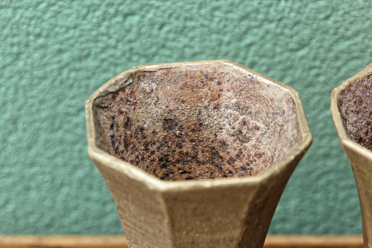 Pair of cast iron cone vases, art deco