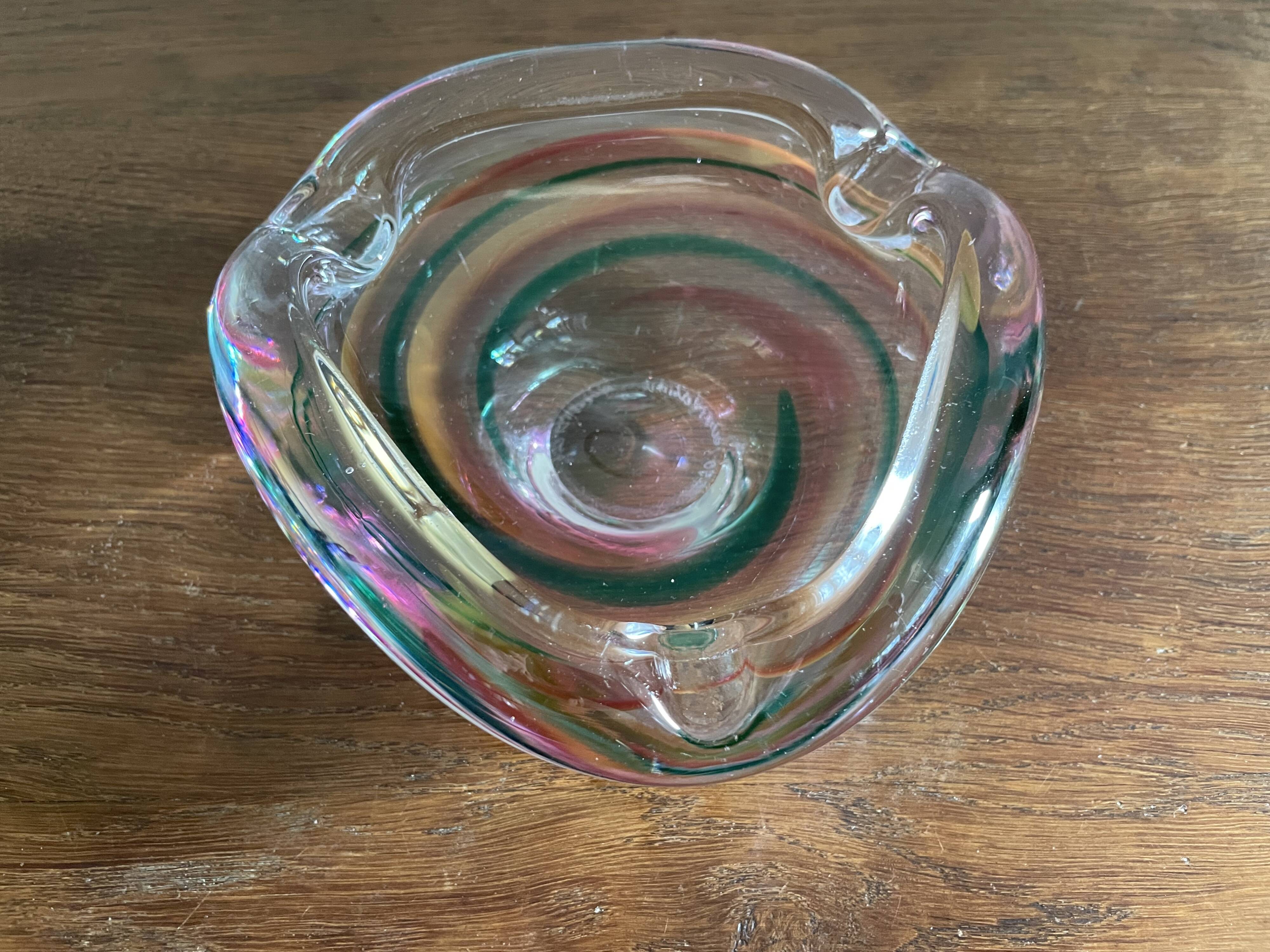 Clear with a soft coloured swirl pattern, round, glass ashtray