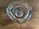 Clear with a soft coloured swirl pattern, round, glass ashtray