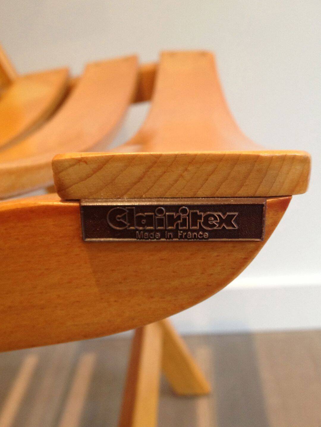 Pair of varnished wooden folding armchairs signed Clairitex.