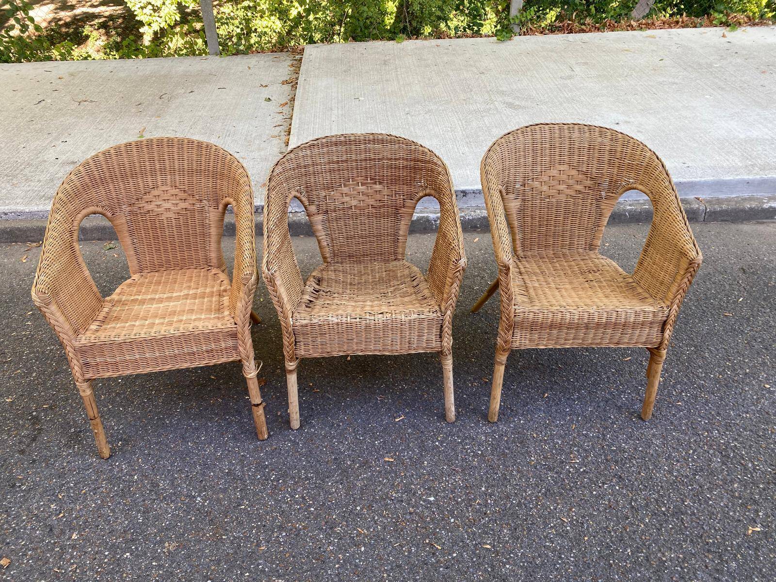 Rattan and woven wicker armchair in vintage bohemian style