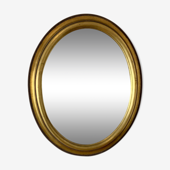 Oval mirror Louis XVI style in gilded wood