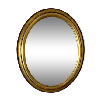 Oval mirror Louis XVI style in gilded wood