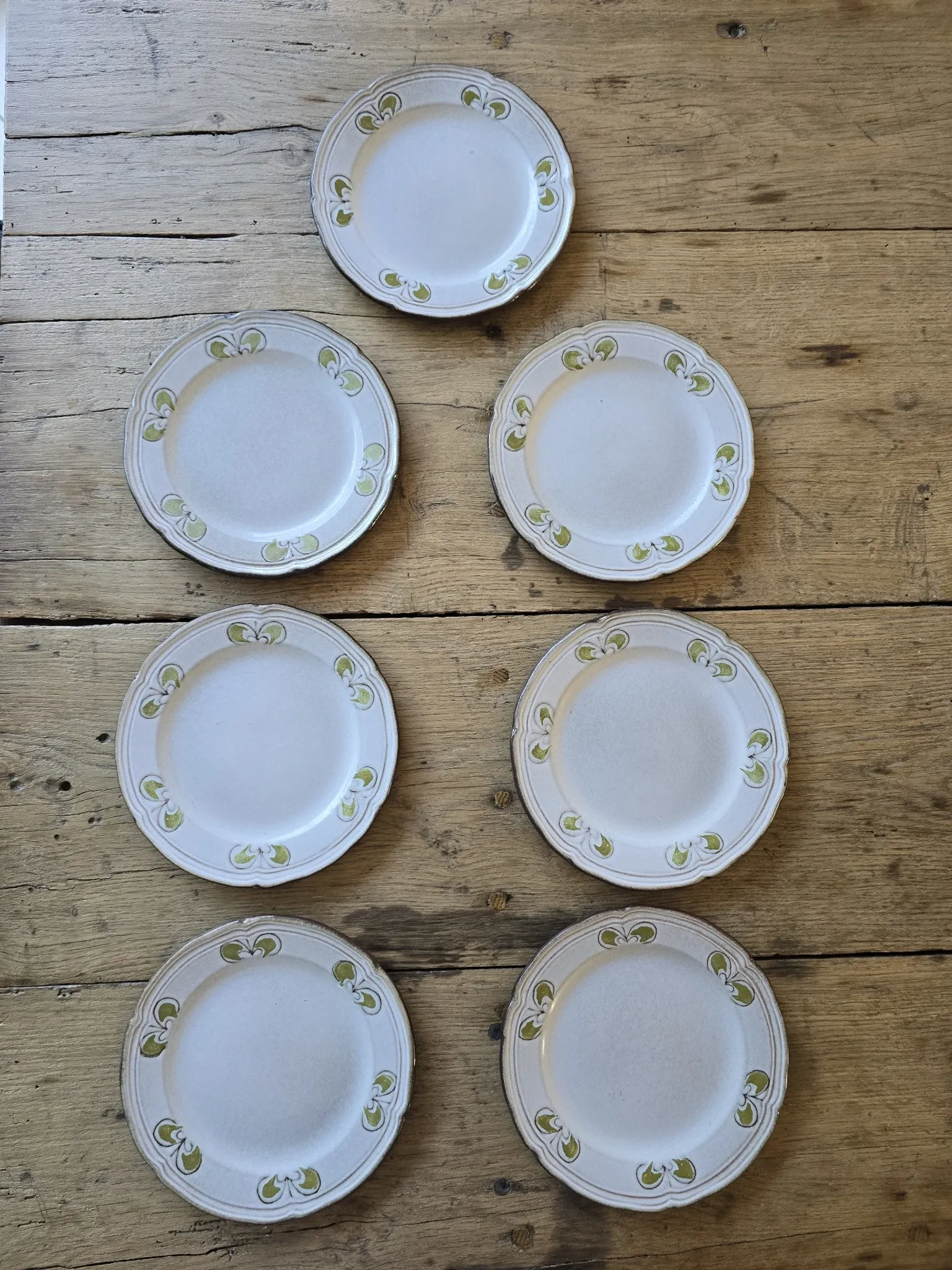Set of 7 vintage Niderviller "Lys" painted stoneware dessert plates.