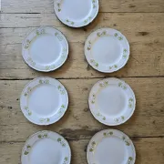 Set of 7 vintage Niderviller "Lys" painted stoneware dessert plates.