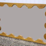 Large antique mirror with an oak frame.