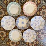 7 matching dessert plates in red green and blue.