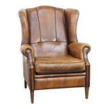 Sheep leather wingback chair finished with black piping