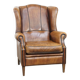 Sheep leather wingback chair finished with black piping