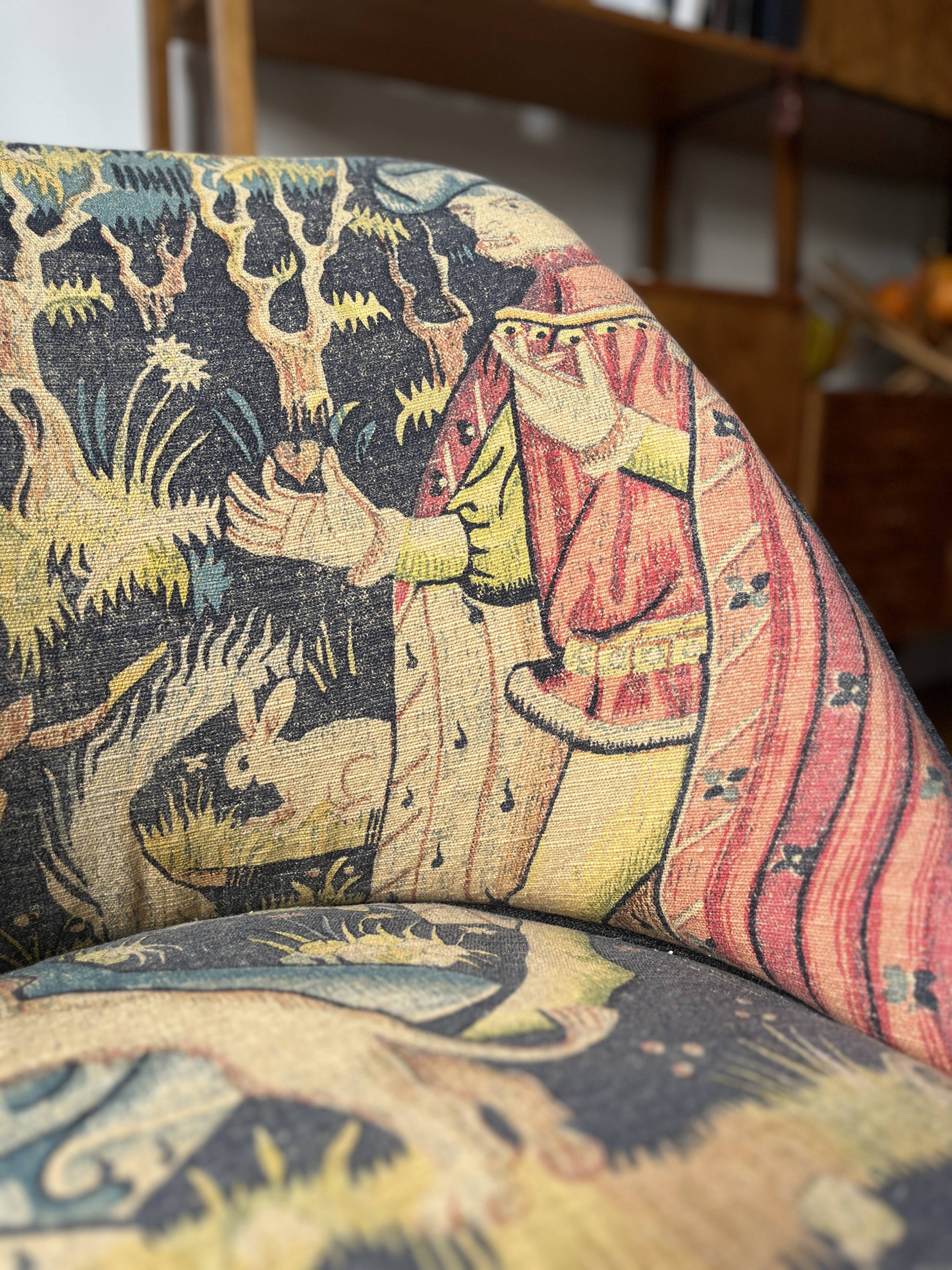 J. Tenreiro, Brazil. Concha armchair with tapered legs, Cluny tapestry 1400.
