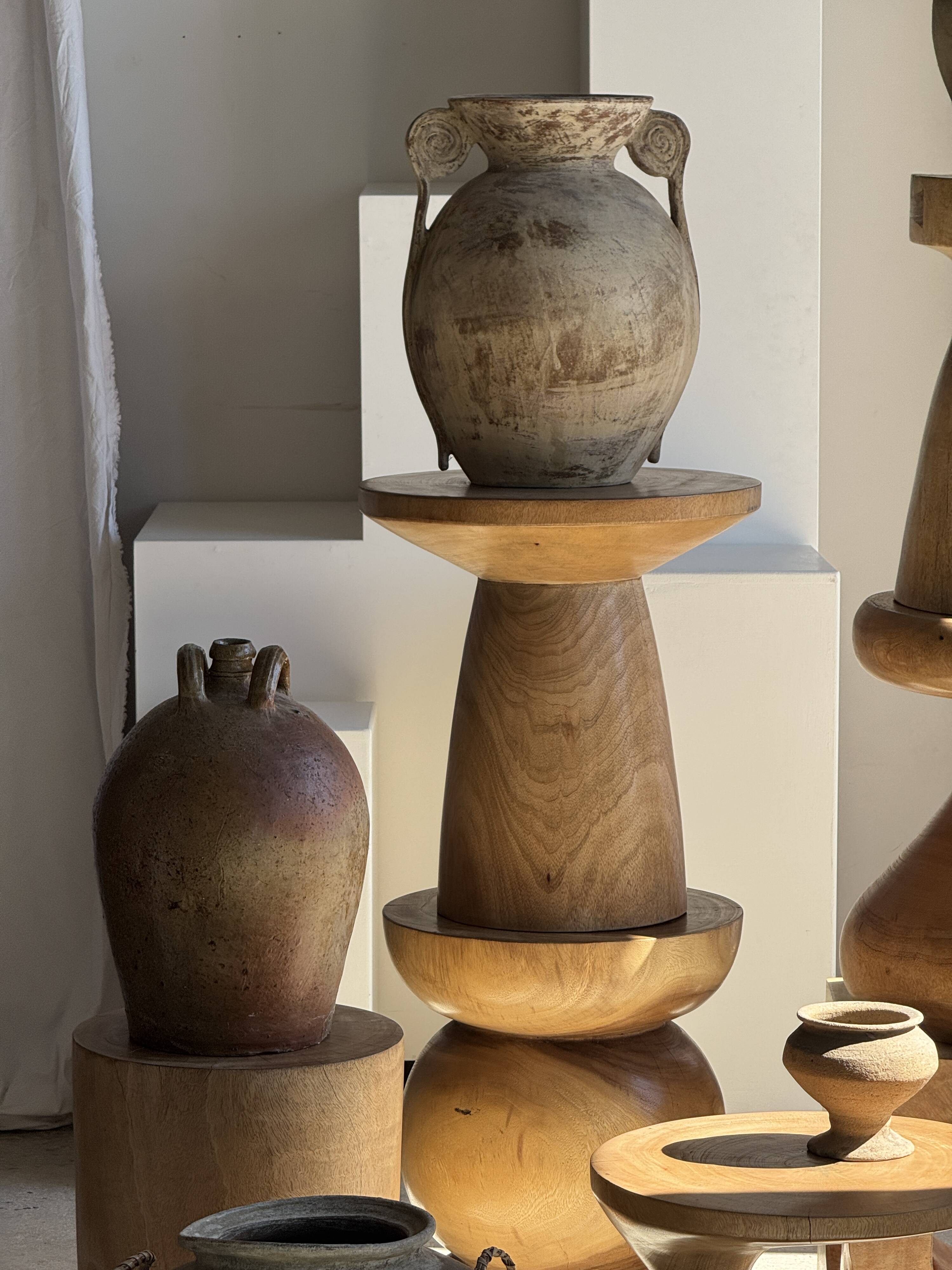 Natural solid mango side table (monoxyle) with conical legs.