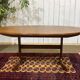 G-Plan oval teak table from the 1970s with a butterfly extension.