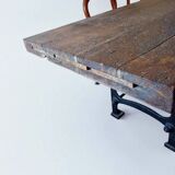 Industrial dining table with cast iron base