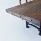 Industrial dining table with cast iron base