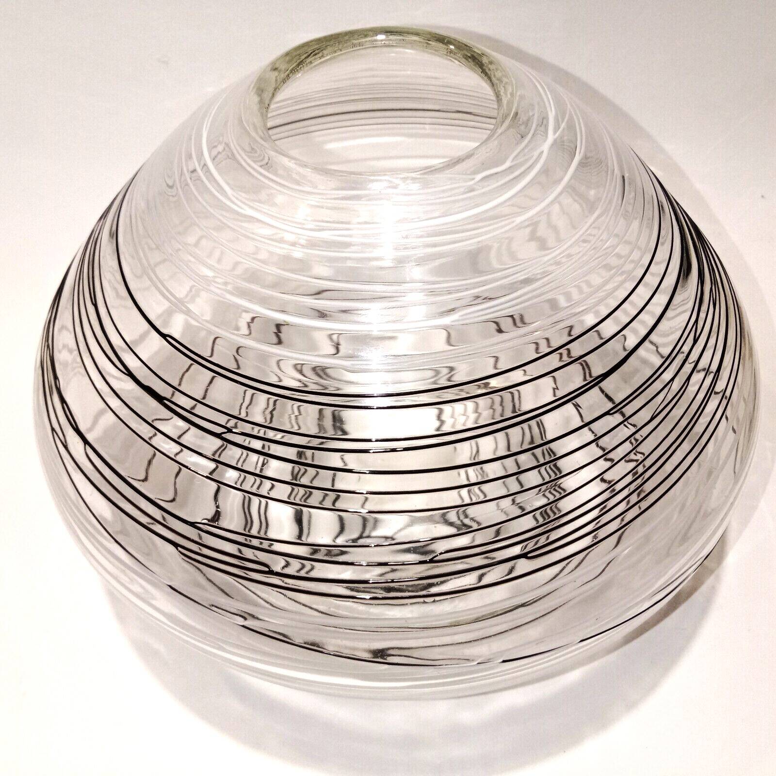 Textured oval blown glass vase with black and white glass spaghetti.