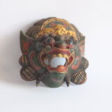 Two polychrome painted and gold leaf gilded Barong dance masks from Bali, Indonesia.