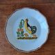 Decorative plate in the 18th-century style. Decoration of a stylised rooster.