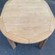 Table à manger scandinave ronde extensible décapée en chêne brut 1970