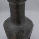 Vintage decanter in glass and tin.