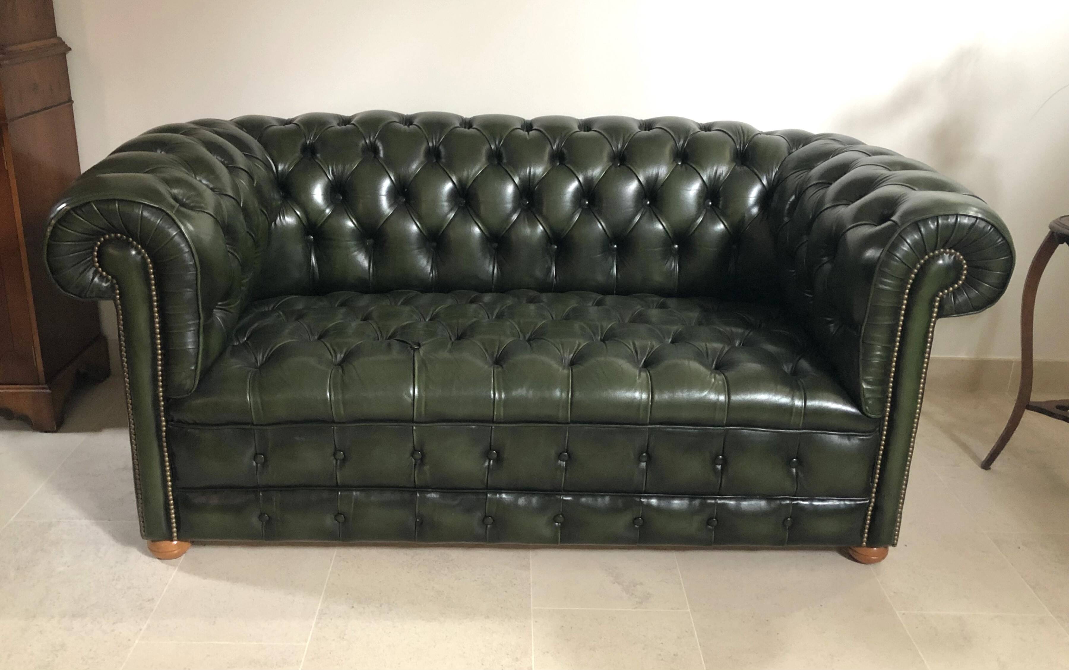 Patinated green English Chesterfield sofa
