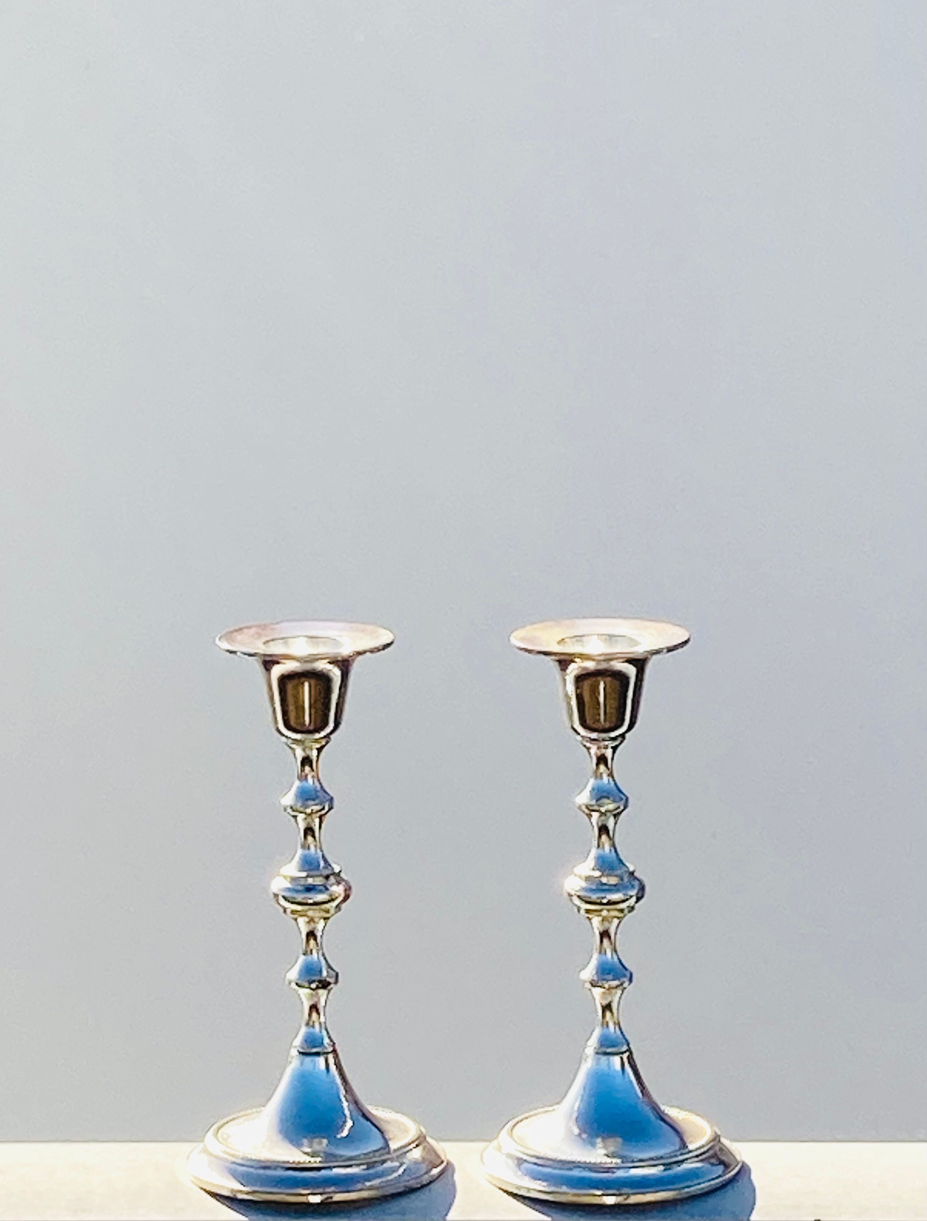 Two metal candle holders