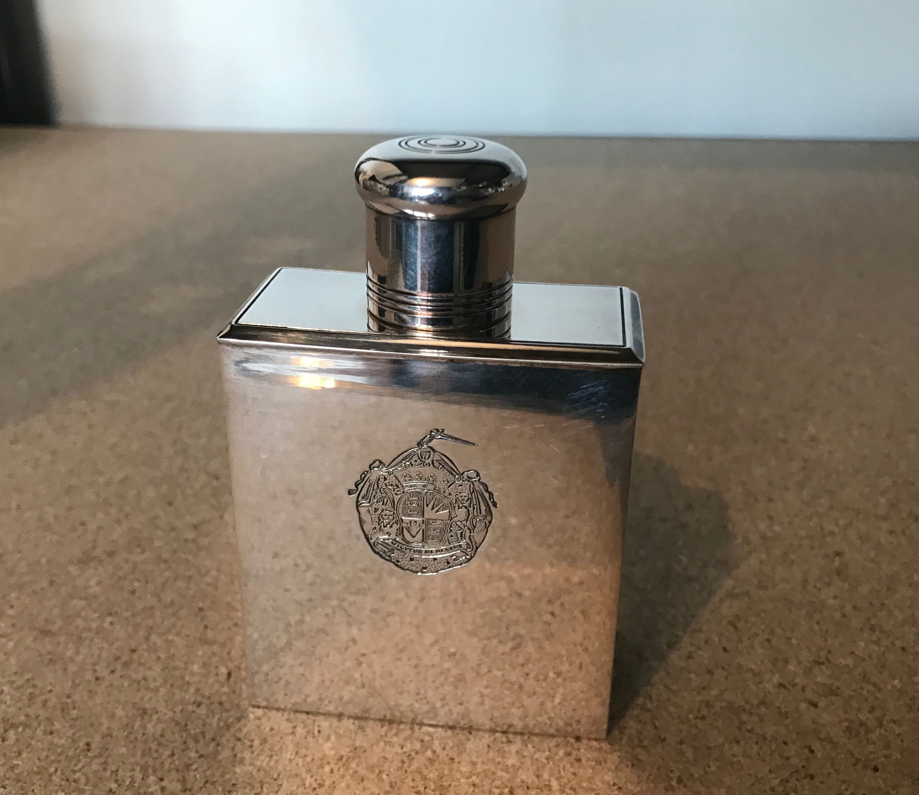 Silver metal perfume bottle