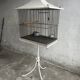 Mid-century pagoda bird cage on stand — white & black metal with brass accents