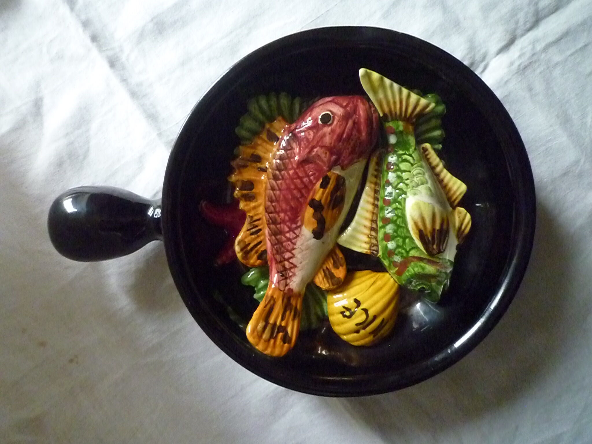 Plate caquelon in vintage slurry style Vallauris theme fish
