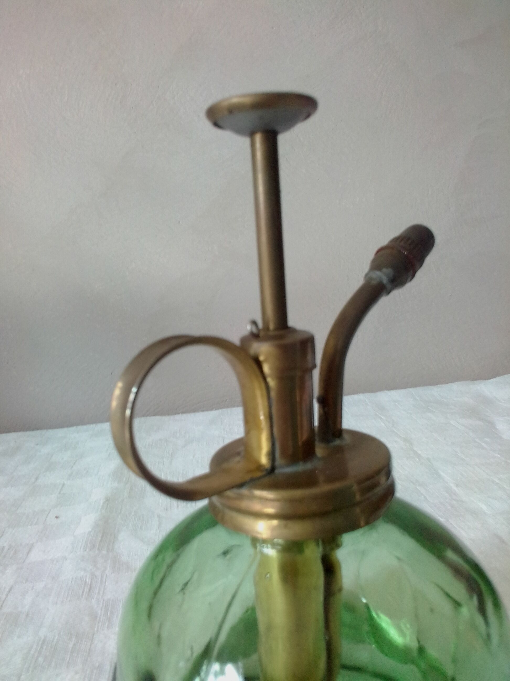 Spray for plants in brass and glass