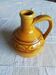 Round ochre glazed jug with handle