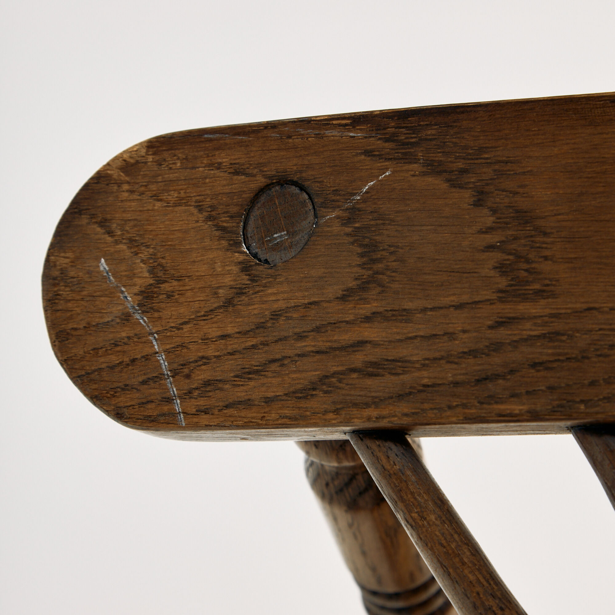 Oak armchair with three legs