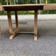 Art Deco dining table with a central pedestal, stripped in solid oak, with 2 extensions.