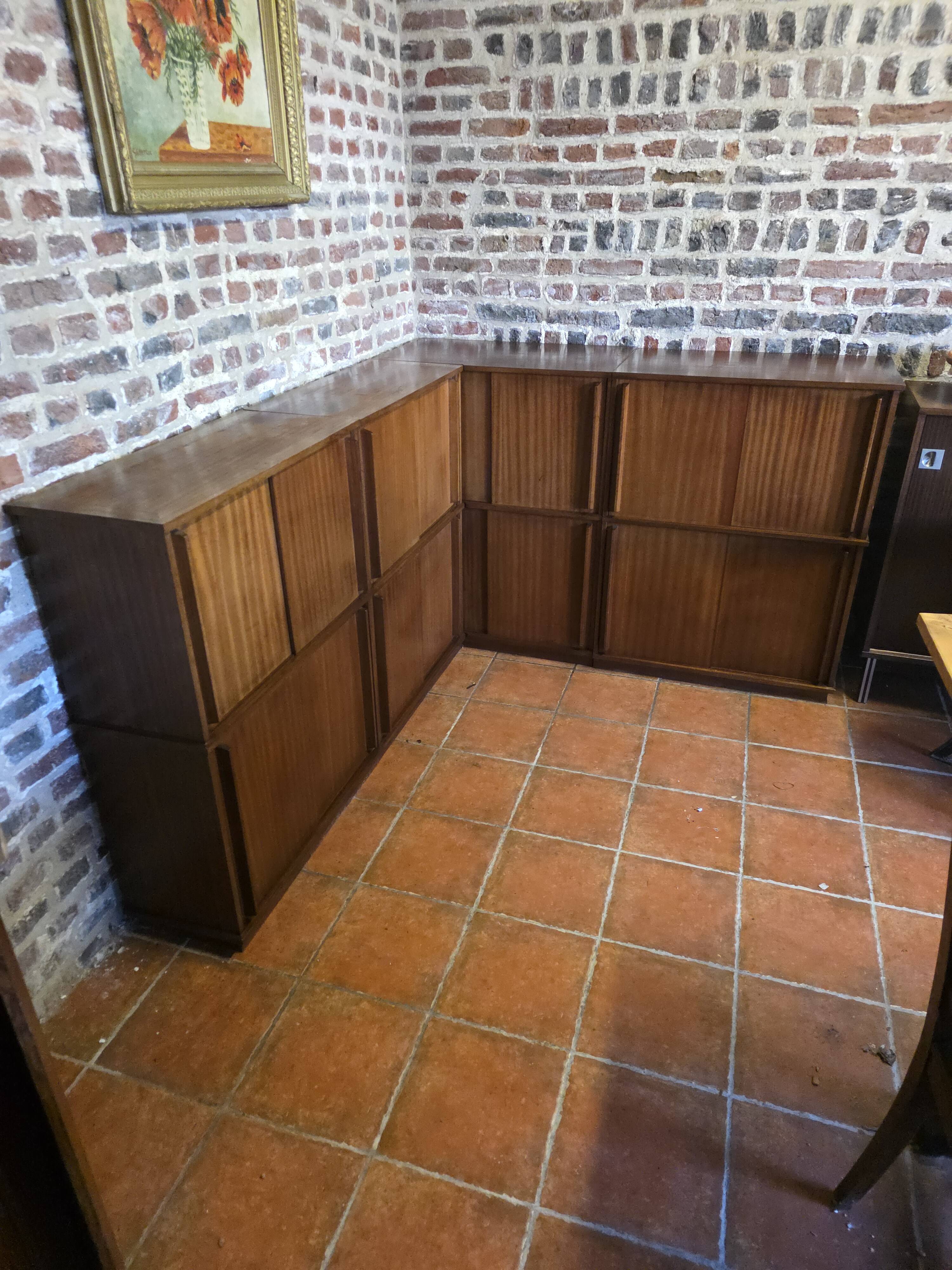 Modular corner library Oscar from the 1960s with sliding doors.