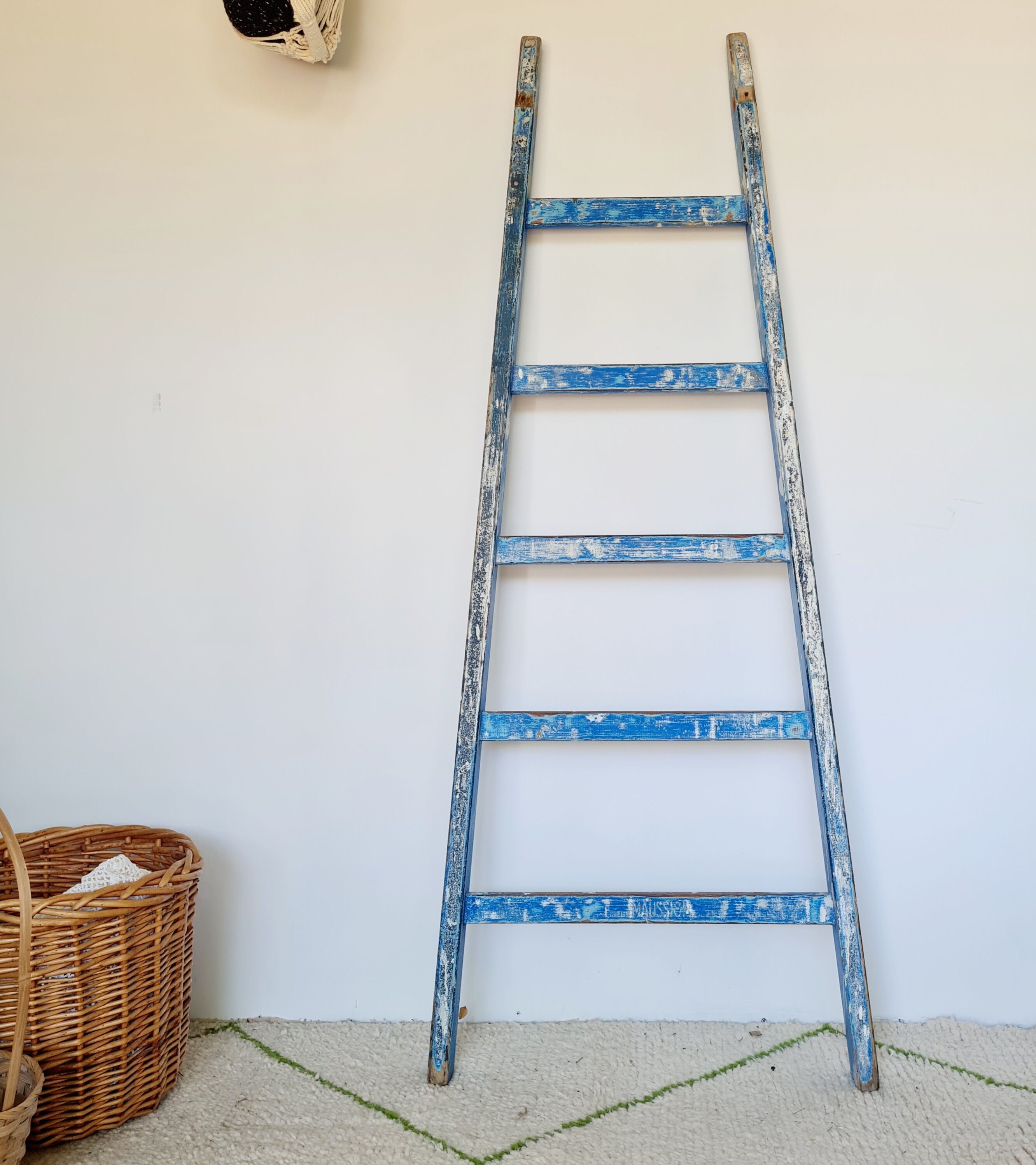 Old ladder in blue wood