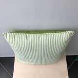 Green and white striped cushion