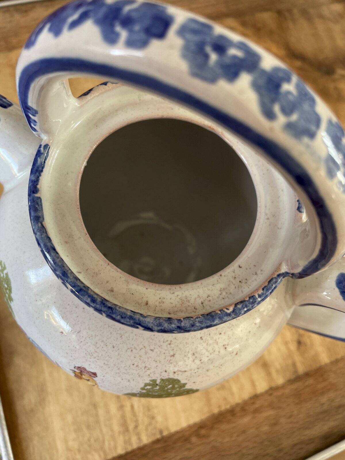 Crucible, ancient teapot made of terracotta.