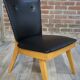 Chair 50 years in wood and faux black leather cocktail