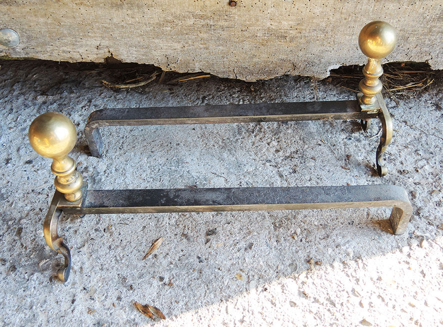 Old brass chenets foot in cabriole