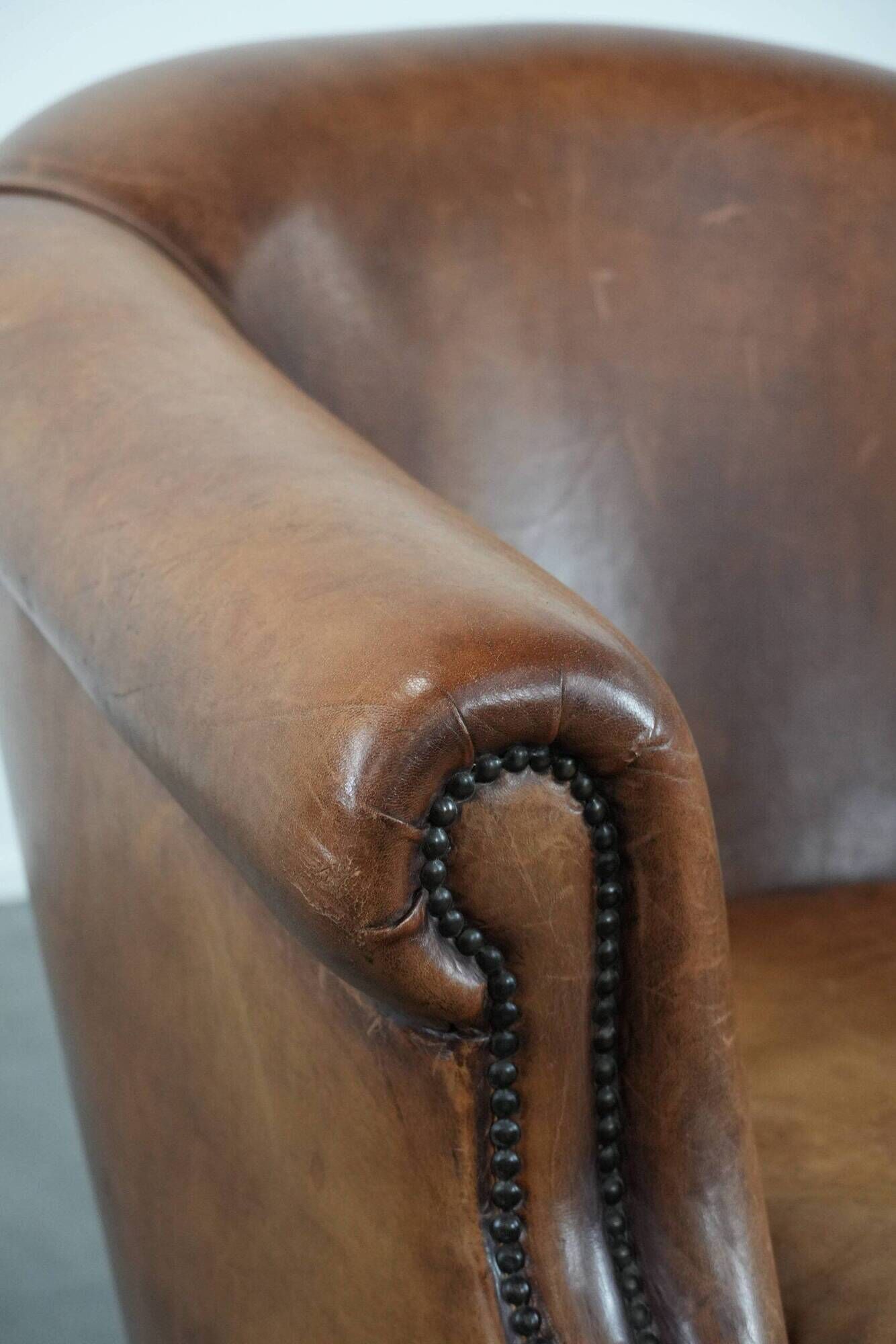 Comfortable club chair made of sheepskin leather