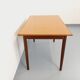 Rectangular dining table in vintage Scandinavian style made of teak and melamine.