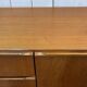 1970s English enfilade in teak with splayed legs.