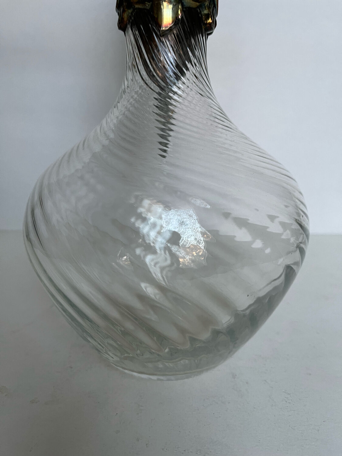 Glass decanter and silver metal frame