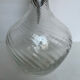 Glass decanter and silver metal frame