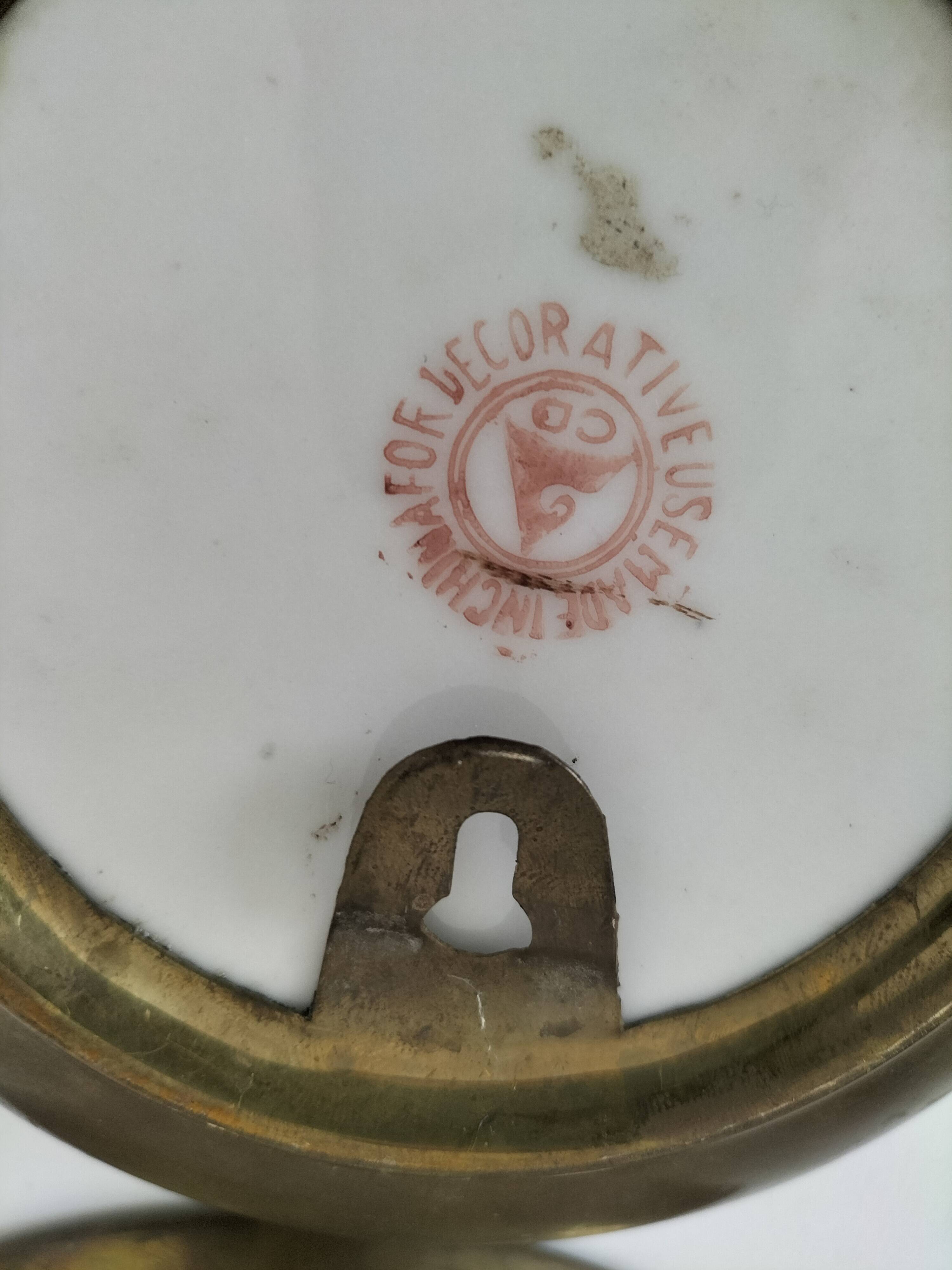 Pair of vintage Chinese decorative plates with floral decoration on a yellow background