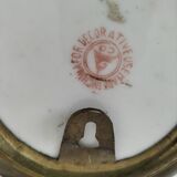 Pair of vintage Chinese decorative plates with floral decoration on a yellow background