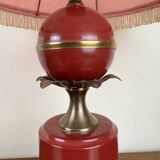 Art deco style desk lamp with a burgundy red sphere in the center the body is in lacquered iron