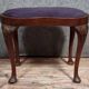 English piano stool in Louis XV style made of mahogany in a bean shape.