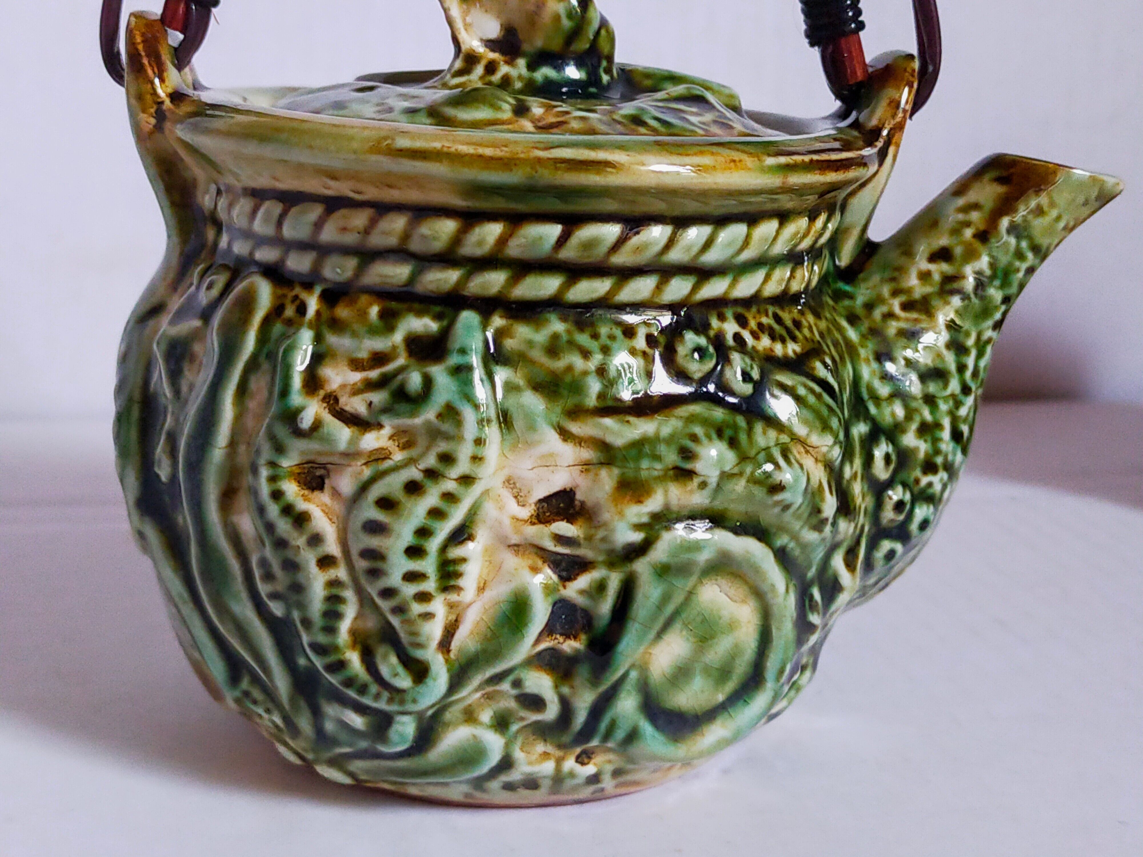 Set of old teapots and honey pot